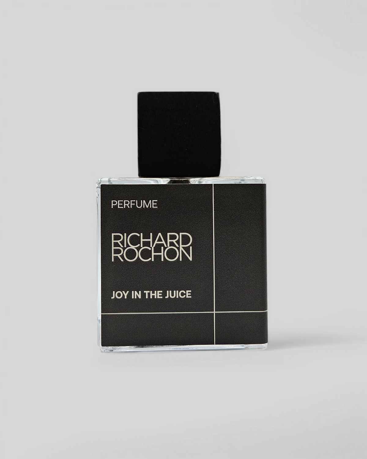 Joy in the Juice perfume packaging and bottle – dark, mineral, and resinous luxury scent